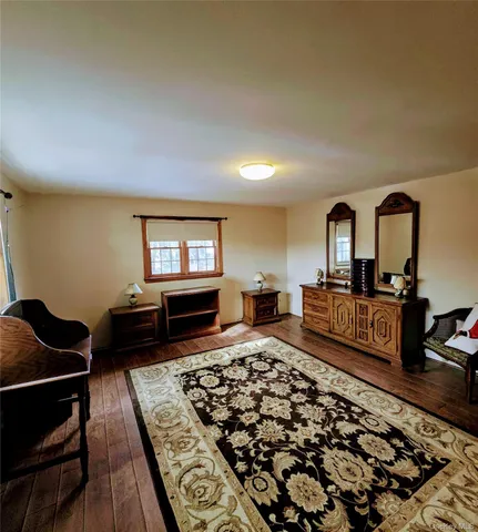 a living room with furniture and a rug