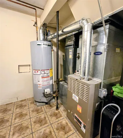 a room with water heater and a shower