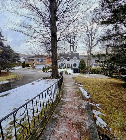 a street view with large trees