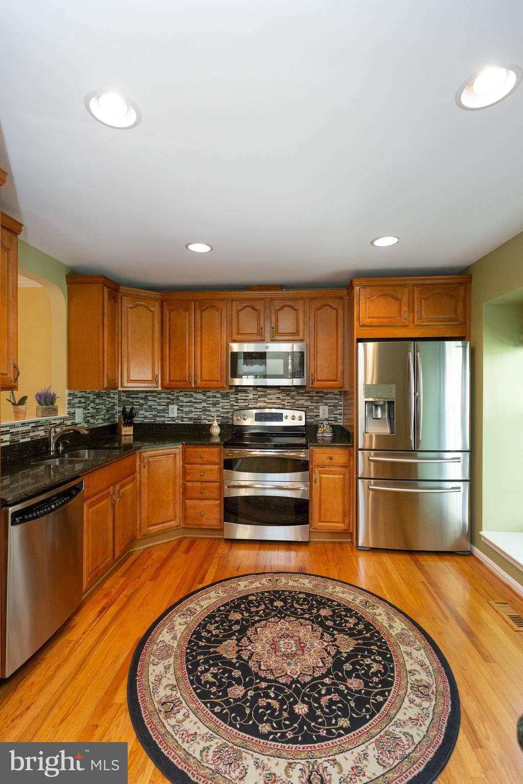 1900 Flowering Tree Terrace Silver Spring, MD 20902 - Photo 13 of 37 Maple Cabinetry w/under cab. lighting