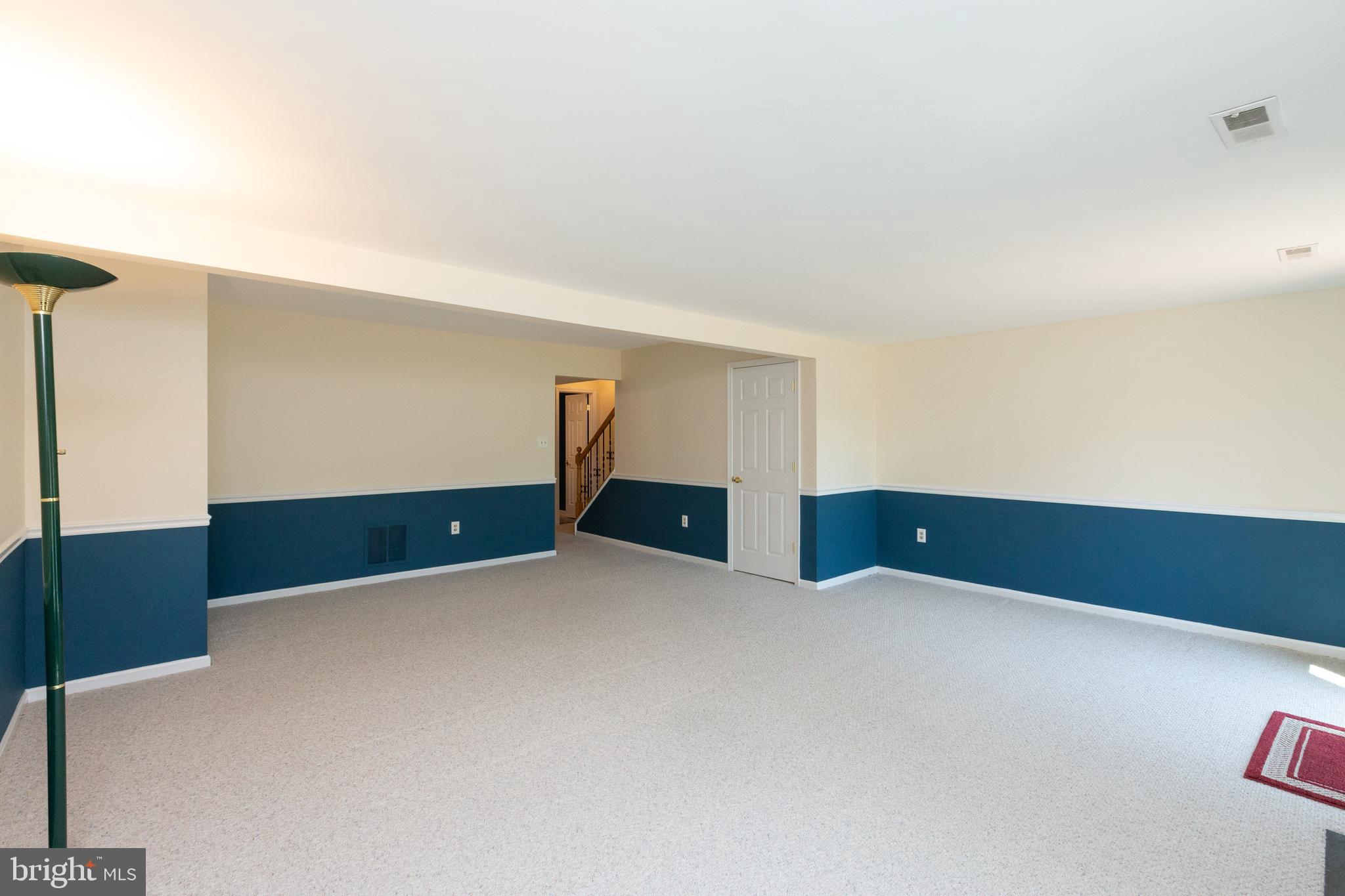 1900 Flowering Tree Terrace Silver Spring, MD 20902 - Photo 28 of 37 View from rear corner towards staircase & 1/2 bath