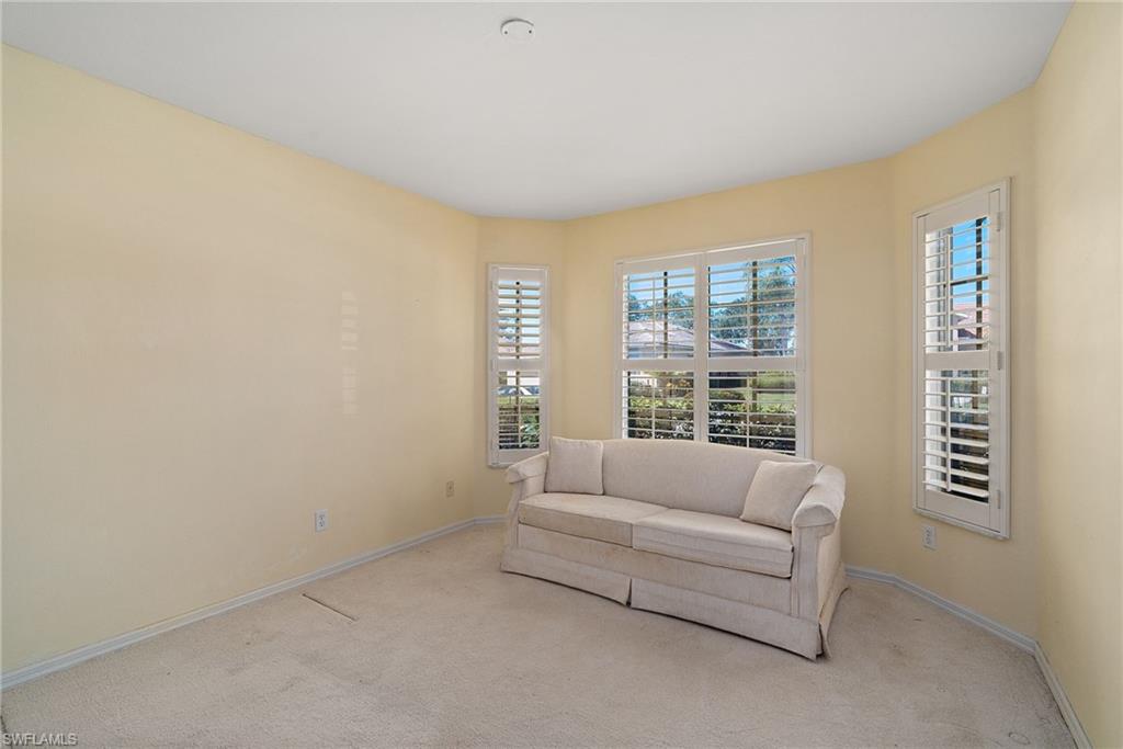 9281 Lanthorn Way Estero, FL 33928 - Photo 11 of 30 a living room with furniture and a window