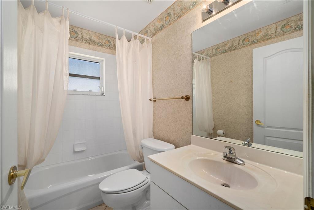 9281 Lanthorn Way Estero, FL 33928 - Photo 12 of 30 a bathroom with a sink toilet and shower