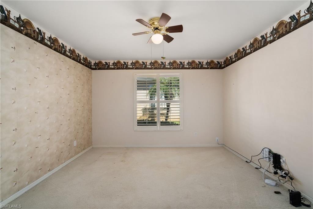9281 Lanthorn Way Estero, FL 33928 - Photo 13 of 30 an empty room with a ceiling fan and a window