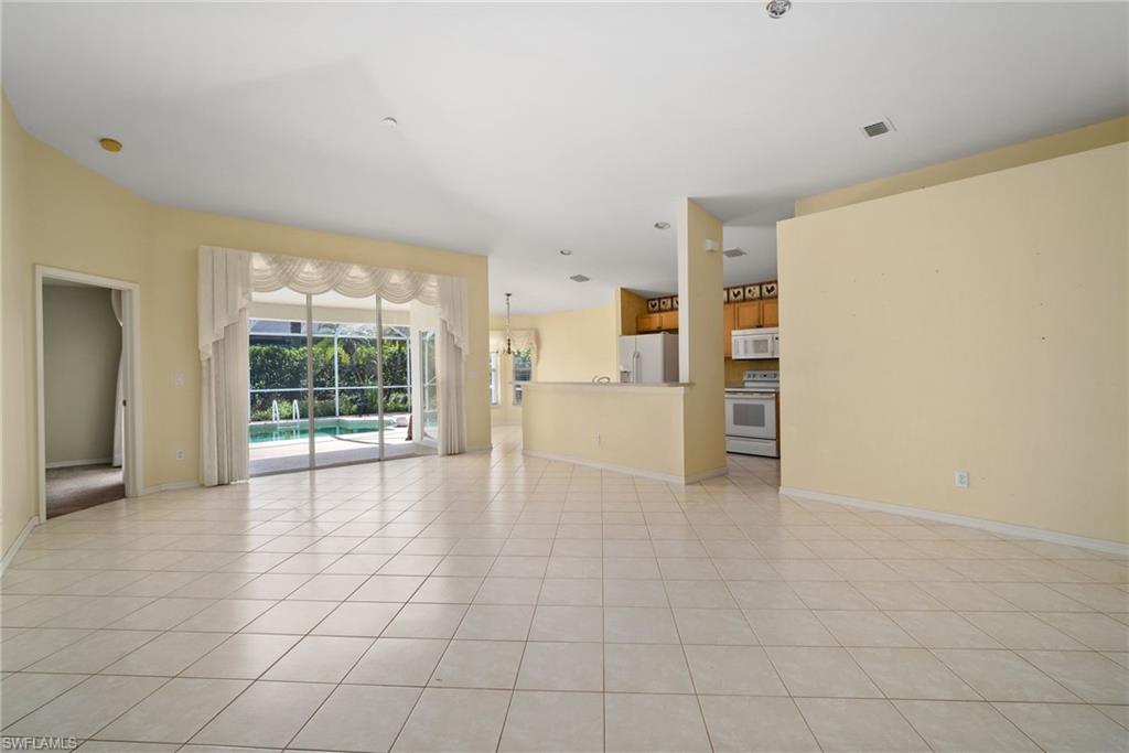 9281 Lanthorn Way Estero, FL 33928 - Photo 14 of 30 a view of an empty room with a stove