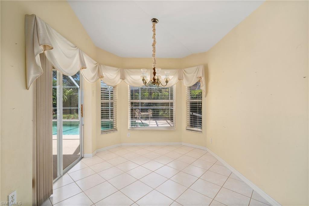 9281 Lanthorn Way Estero, FL 33928 - Photo 18 of 30 a view of an empty room with a window