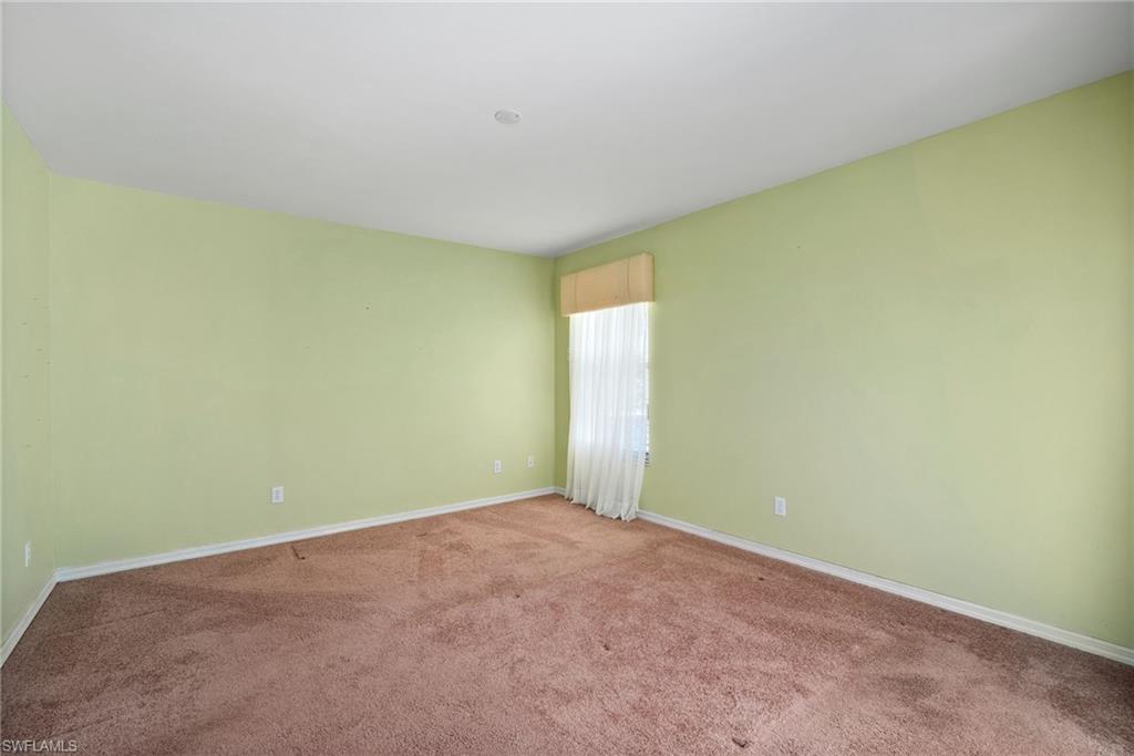9281 Lanthorn Way Estero, FL 33928 - Photo 20 of 30 an empty room with a empty space and a window