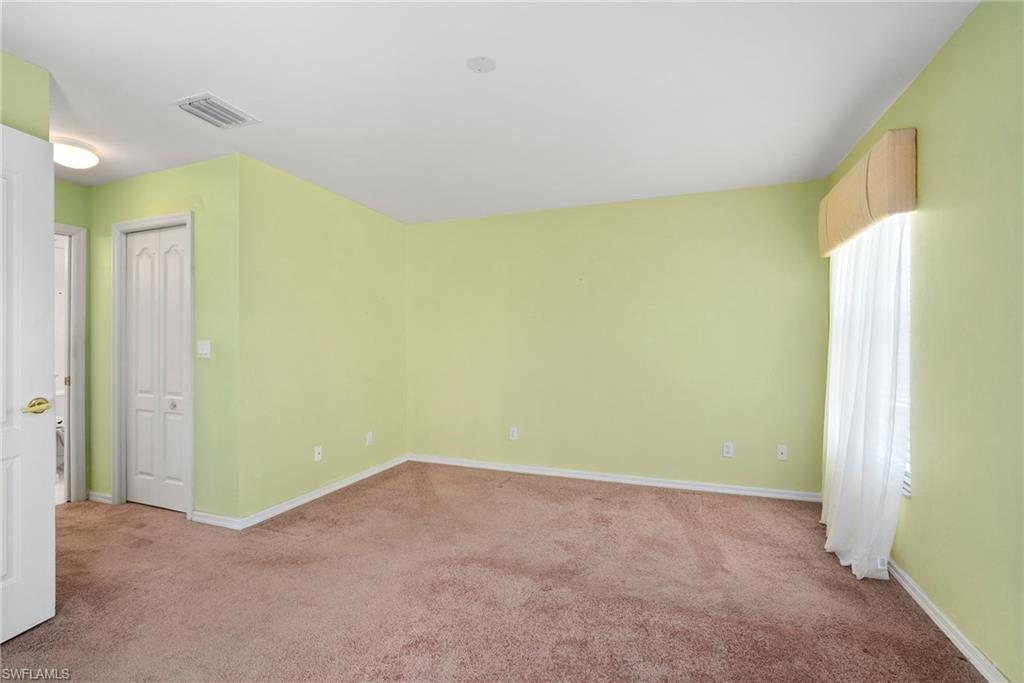 9281 Lanthorn Way Estero, FL 33928 - Photo 21 of 30 a view of a big room with windows