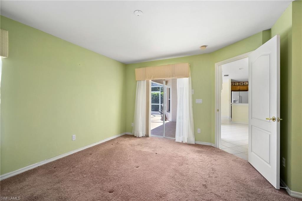 9281 Lanthorn Way Estero, FL 33928 - Photo 22 of 30 a view of an empty room and window