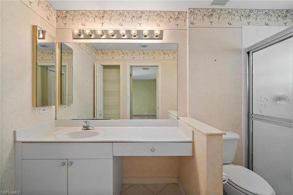 9281 Lanthorn Way Estero, FL 33928 - Photo 23 of 30 a bathroom with a sink and a mirror