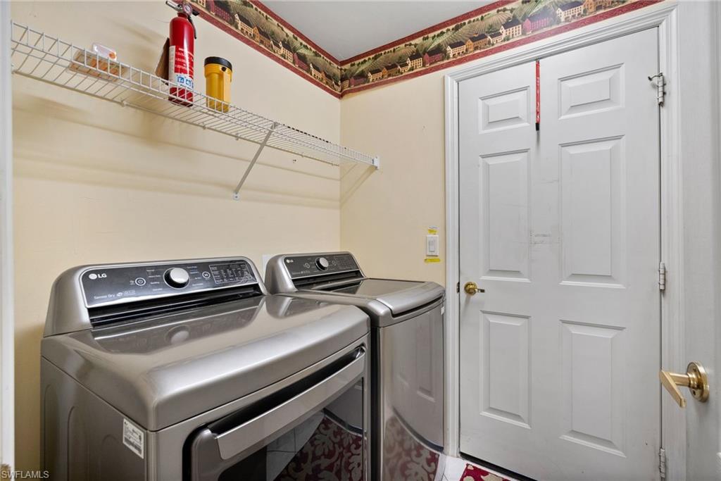 9281 Lanthorn Way Estero, FL 33928 - Photo 25 of 30 a utility room with dryer and washer