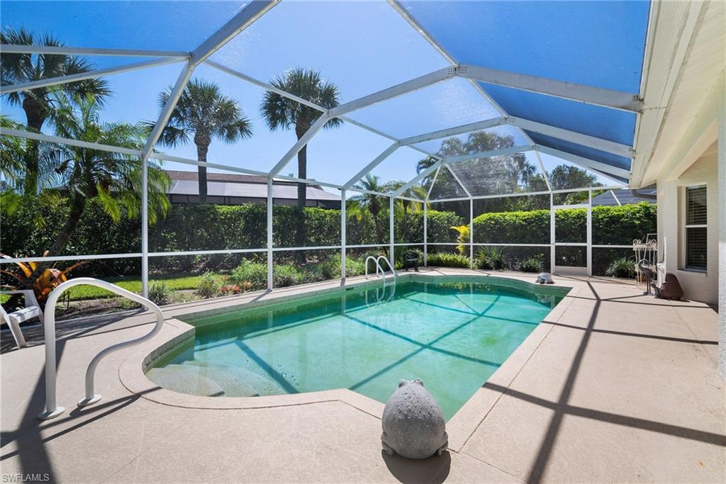 9281 Lanthorn Way Estero, FL 33928 - Photo 29 of 30 a view of a backyard with table and chairs potted plants