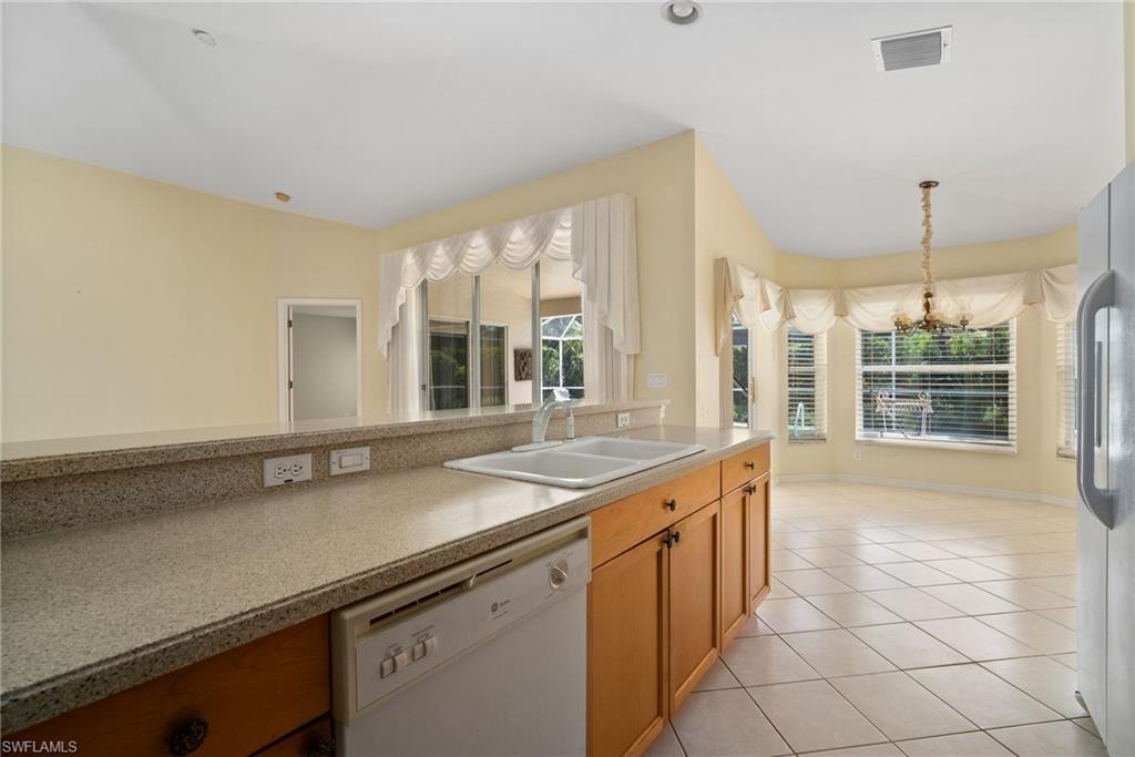 9281 Lanthorn Way Estero, FL 33928 - Photo 5 of 30 a kitchen with a sink and large window