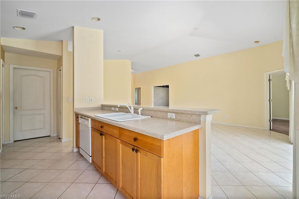 9281 Lanthorn Way Estero, FL 33928 - Photo 7 of 30 a bathroom with a sink a mirror and a shower