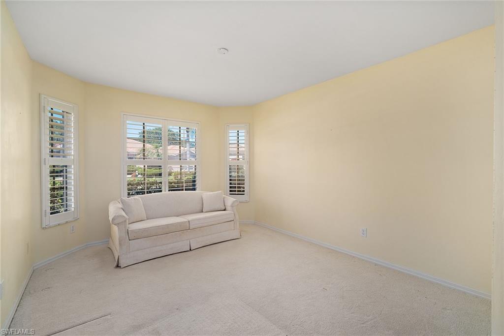 9281 Lanthorn Way Estero, FL 33928 - Photo 10 of 30 a living room with furniture and a window