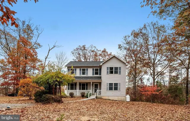 aerial view of a house with a yard