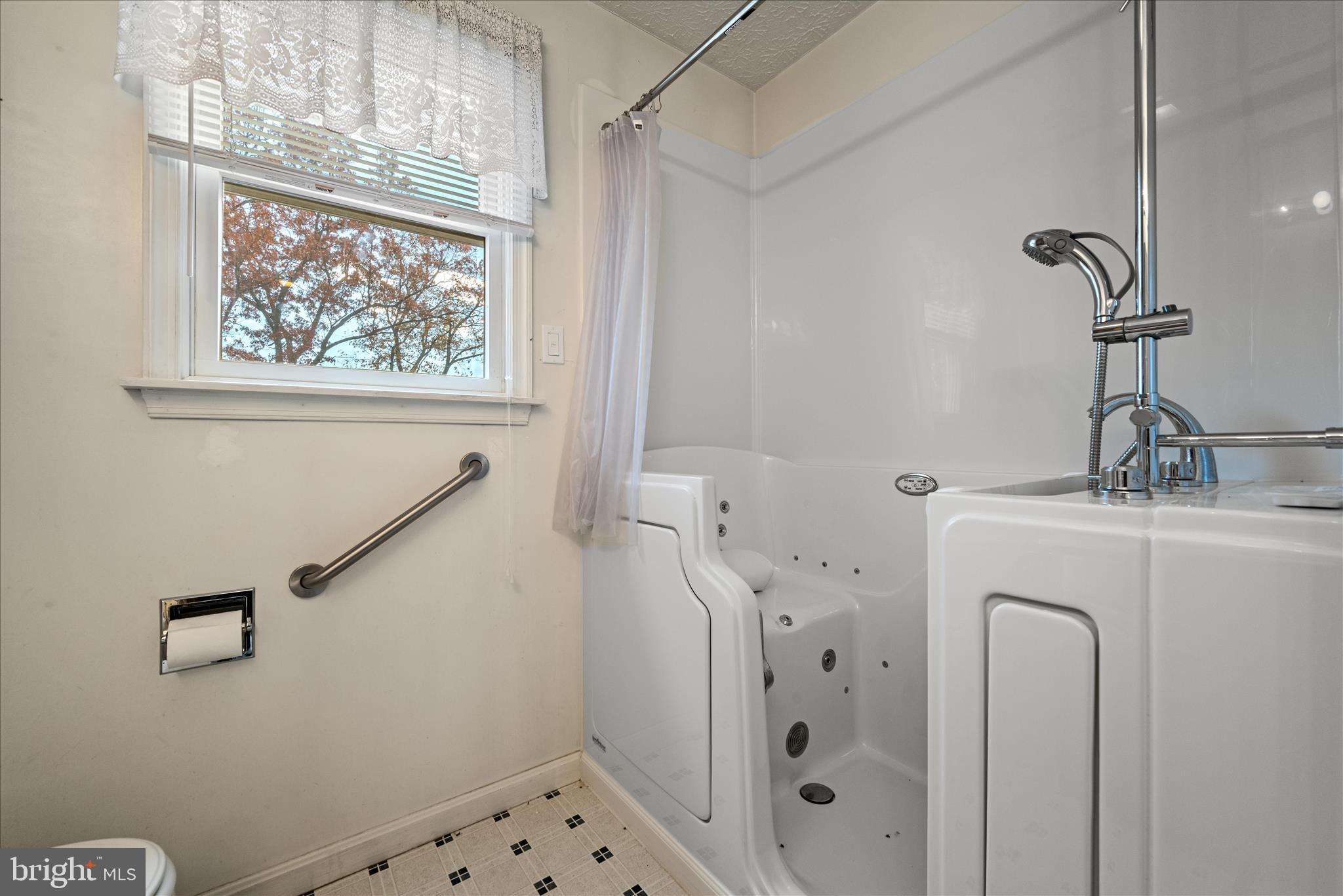 4403 Back Mountain Road Winchester, VA 22602 - Photo 24 of 73 a bathroom with a bathtub and a window