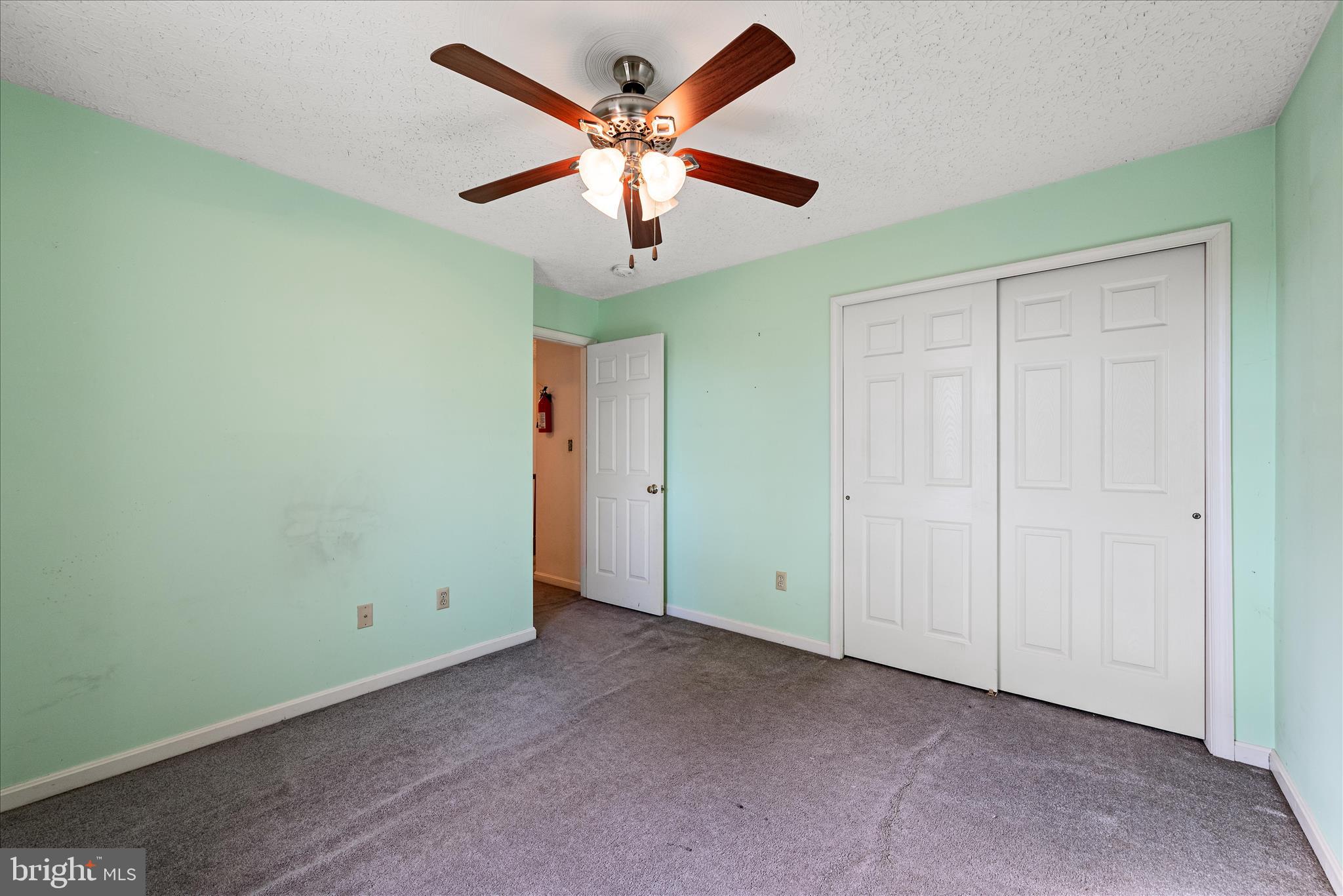 4403 Back Mountain Road Winchester, VA 22602 - Photo 27 of 73 an empty room with a ceiling fan and a window