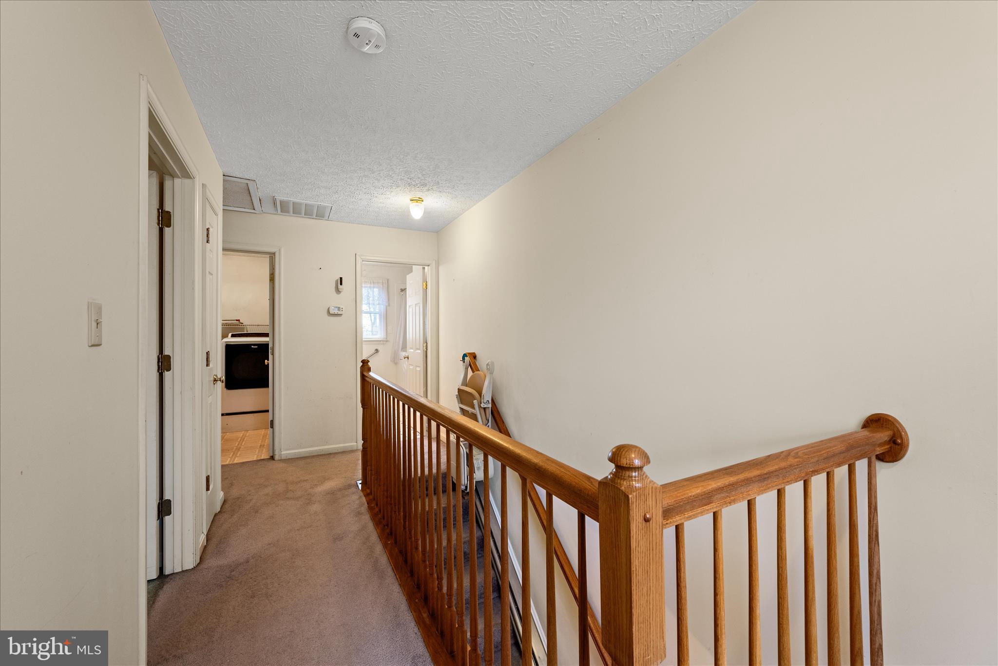 4403 Back Mountain Road Winchester, VA 22602 - Photo 37 of 73 a view of a hallway with wooden floor and staircase