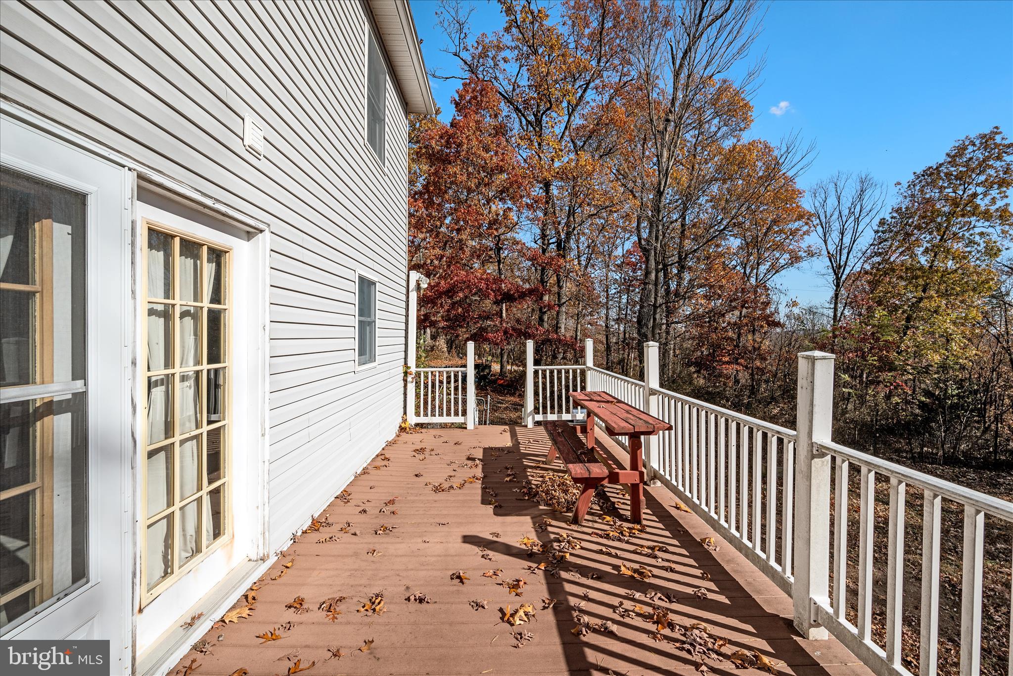 4403 Back Mountain Road Winchester, VA 22602 - Photo 42 of 73 a view of a balcony with wooden floor and fence
