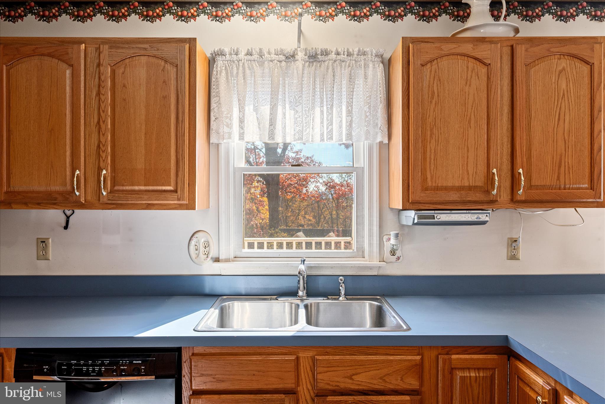 4403 Back Mountain Road Winchester, VA 22602 - Photo 9 of 73 a kitchen with stainless steel appliances granite countertop a refrigerator and a sink