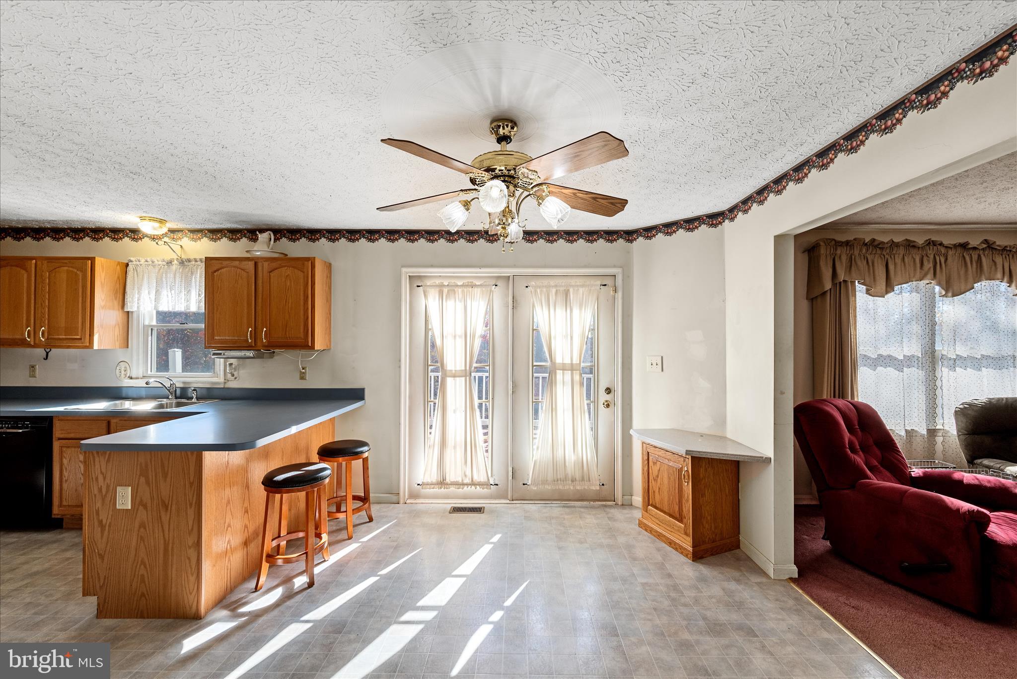 4403 Back Mountain Road Winchester, VA 22602 - Photo 10 of 73 a kitchen with stainless steel appliances granite countertop a sink a stove and a refrigerator