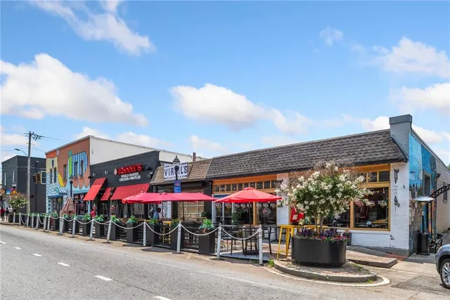 a view of street with sitting area