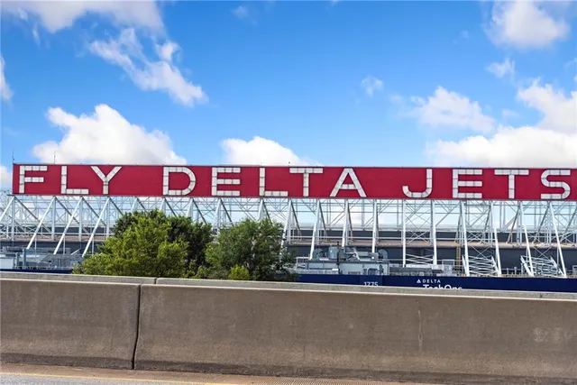 a view of a city sign in front of a building