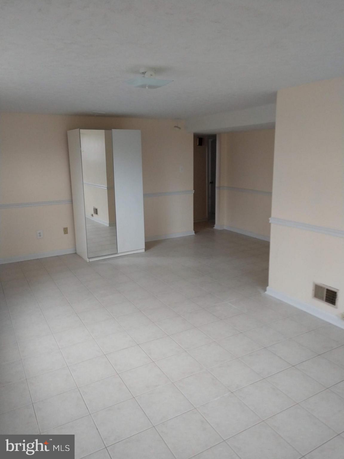 1906 Reedie Drive Silver Spring, MD 20902 - Photo 13 of 19 Basement recreation area