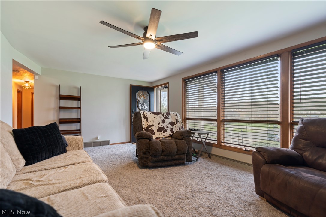 4904 3rd Street Northwest Canton, OH 44708 - Photo 6 of 31 Carpeted living room with ceiling fan