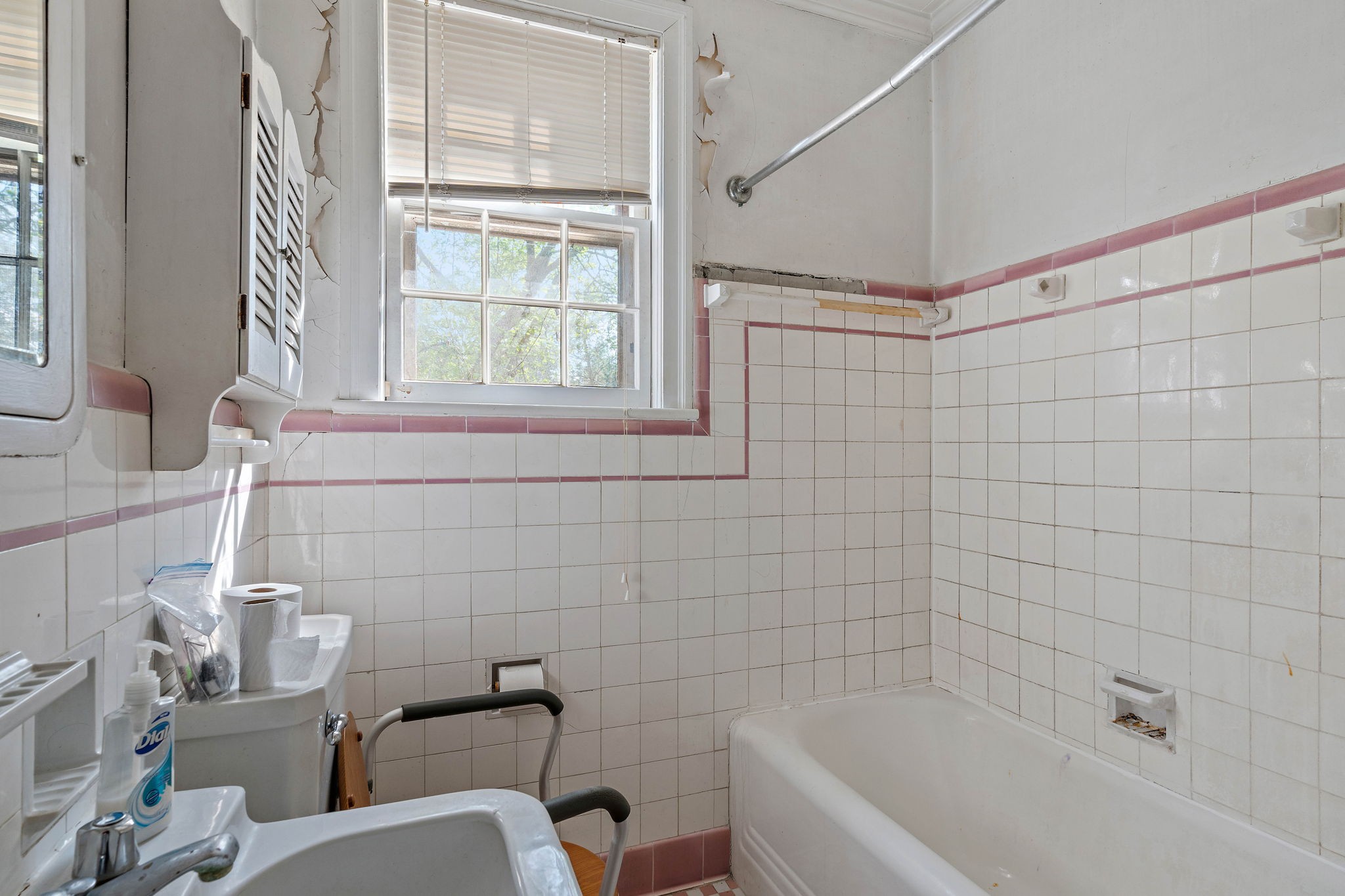 225 Mockingbird Road Nashville, TN 37205 - Photo 16 of 35 a bathroom with a bathtub a window and a shower