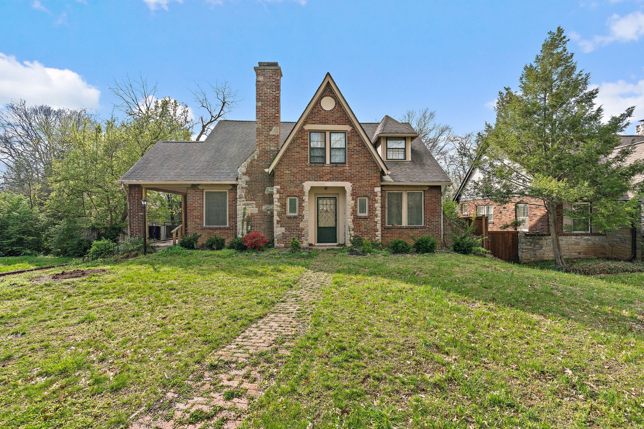 225 Mockingbird Road Nashville, TN 37205 - Photo 2 of 35 a front view of a house with a yard