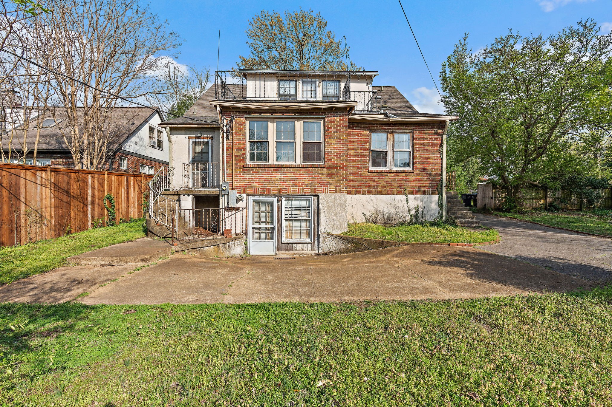 225 Mockingbird Road Nashville, TN 37205 - Photo 29 of 35 a front view of a house with a yard and garage