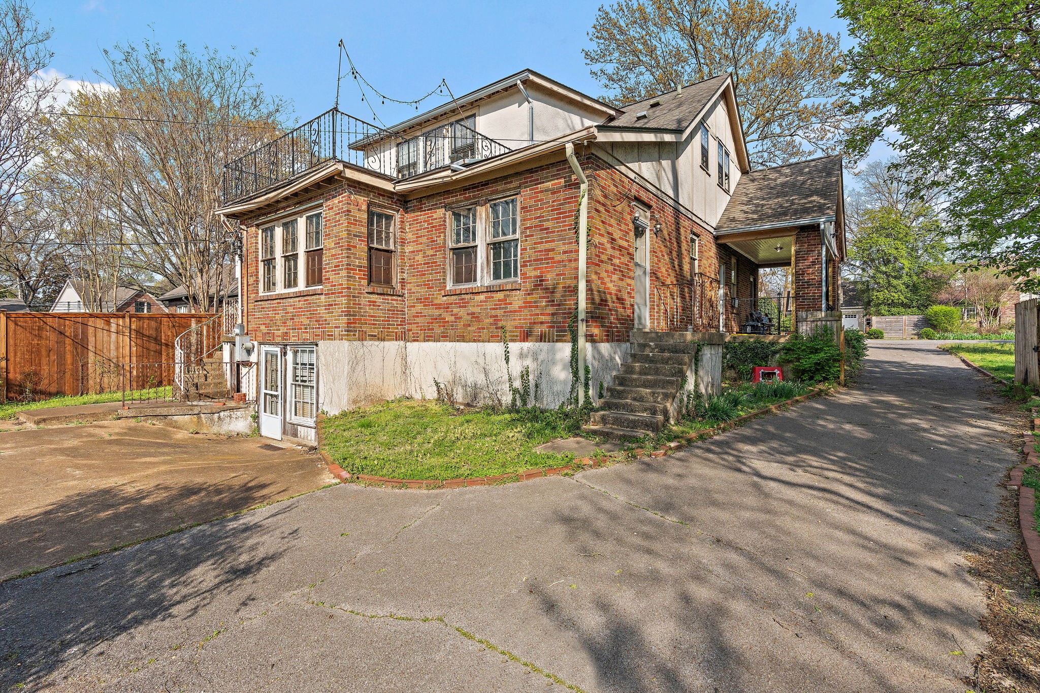 225 Mockingbird Road Nashville, TN 37205 - Photo 30 of 35 a front view of a house with a yard and garage