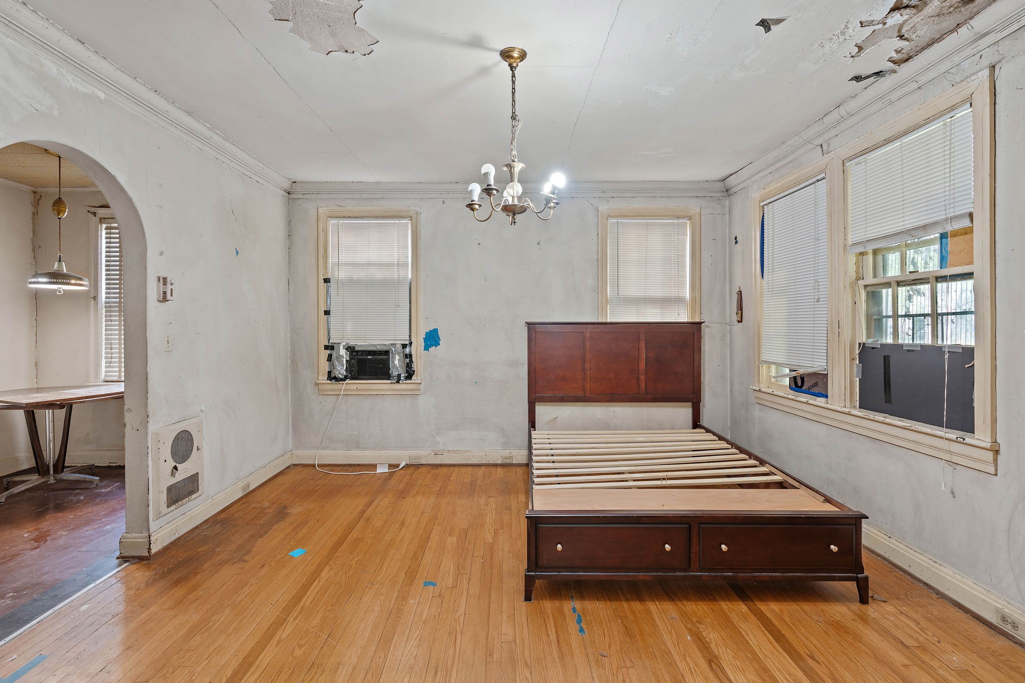 225 Mockingbird Road Nashville, TN 37205 - Photo 7 of 35 a bedroom with a bed chandelier and a window