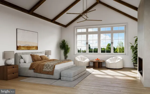 a bedroom with a bed and a large window