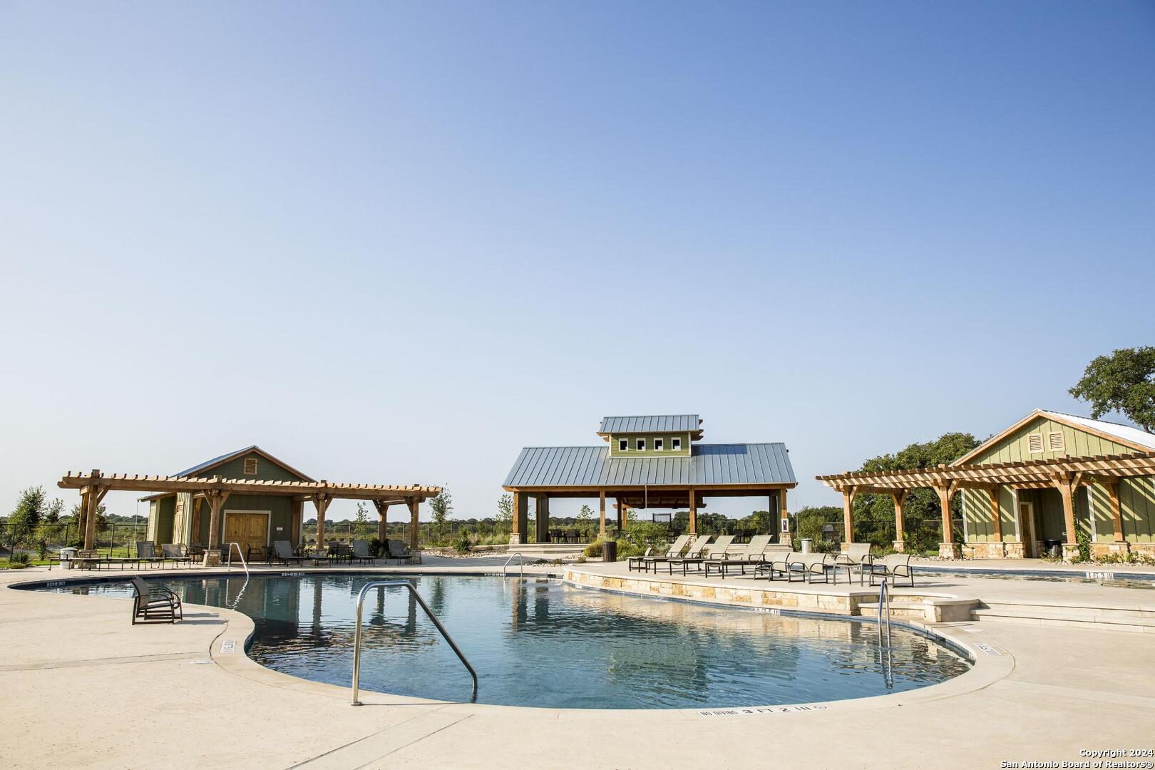 8206 Chalk Trace Schertz, TX 78154 - Photo 7 of 8 a view of a swimming pool with an outdoor seating