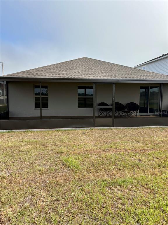 2405 Bluestone Road Haines City, FL 33844 - Photo 18 of 18 a front view of a building with a yard