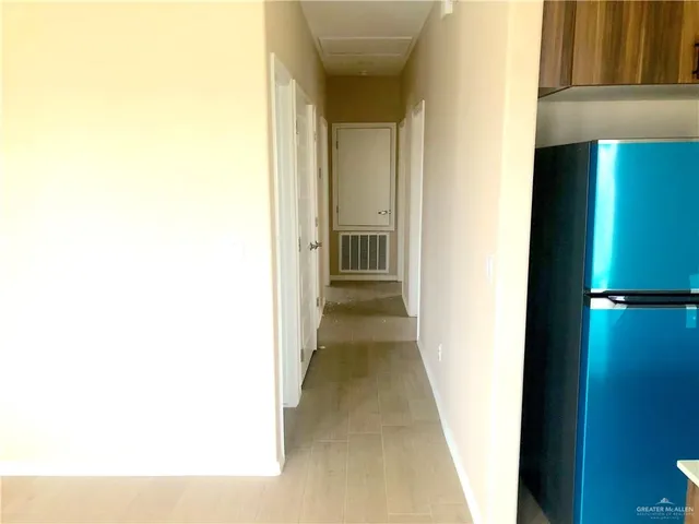 a view of a hallway with closet