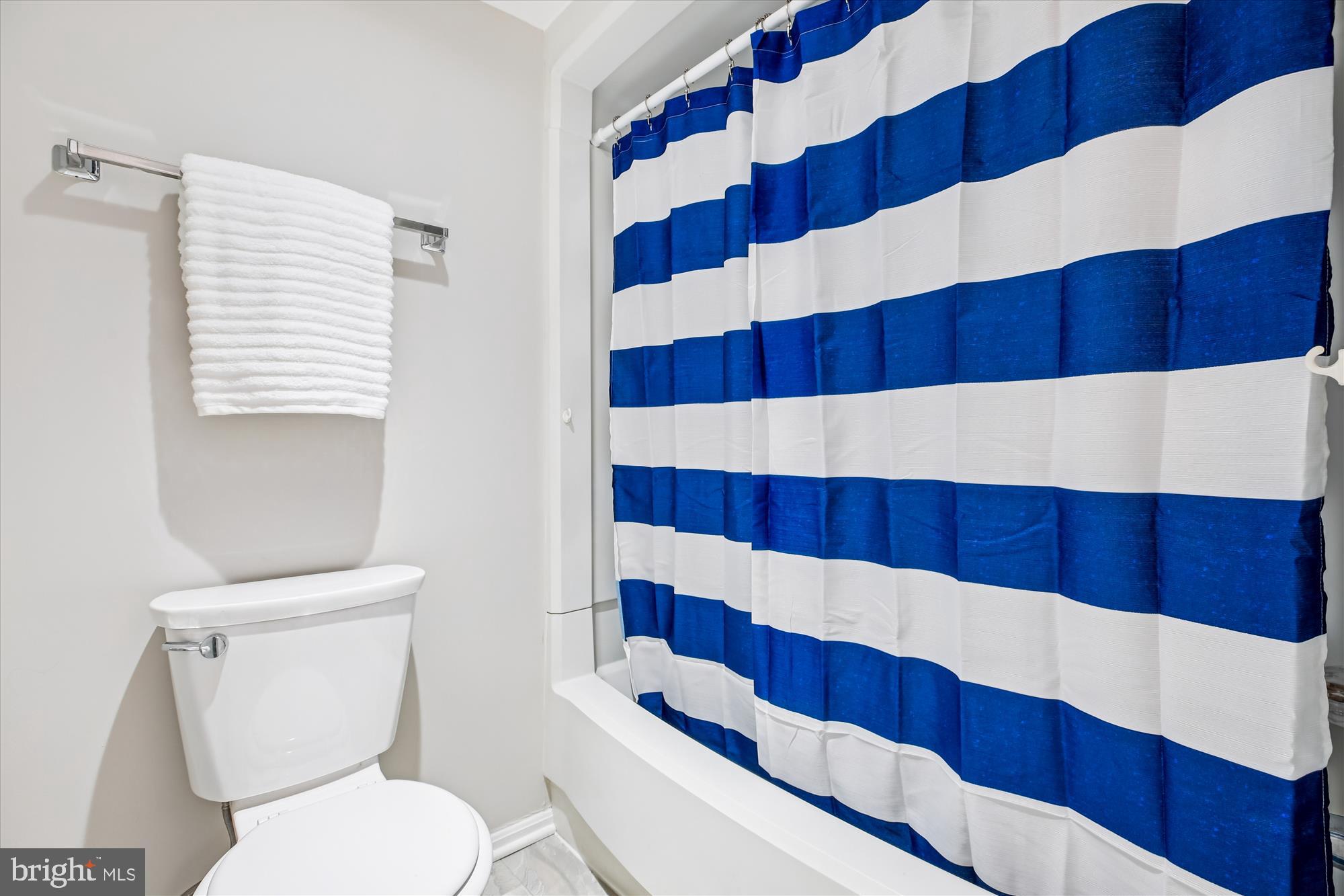 15115 Interlachen Drive, Unit 3308 Silver Spring, MD 20906 - Photo 16 of 50 a bathroom with a sink a toilet and a mirror
