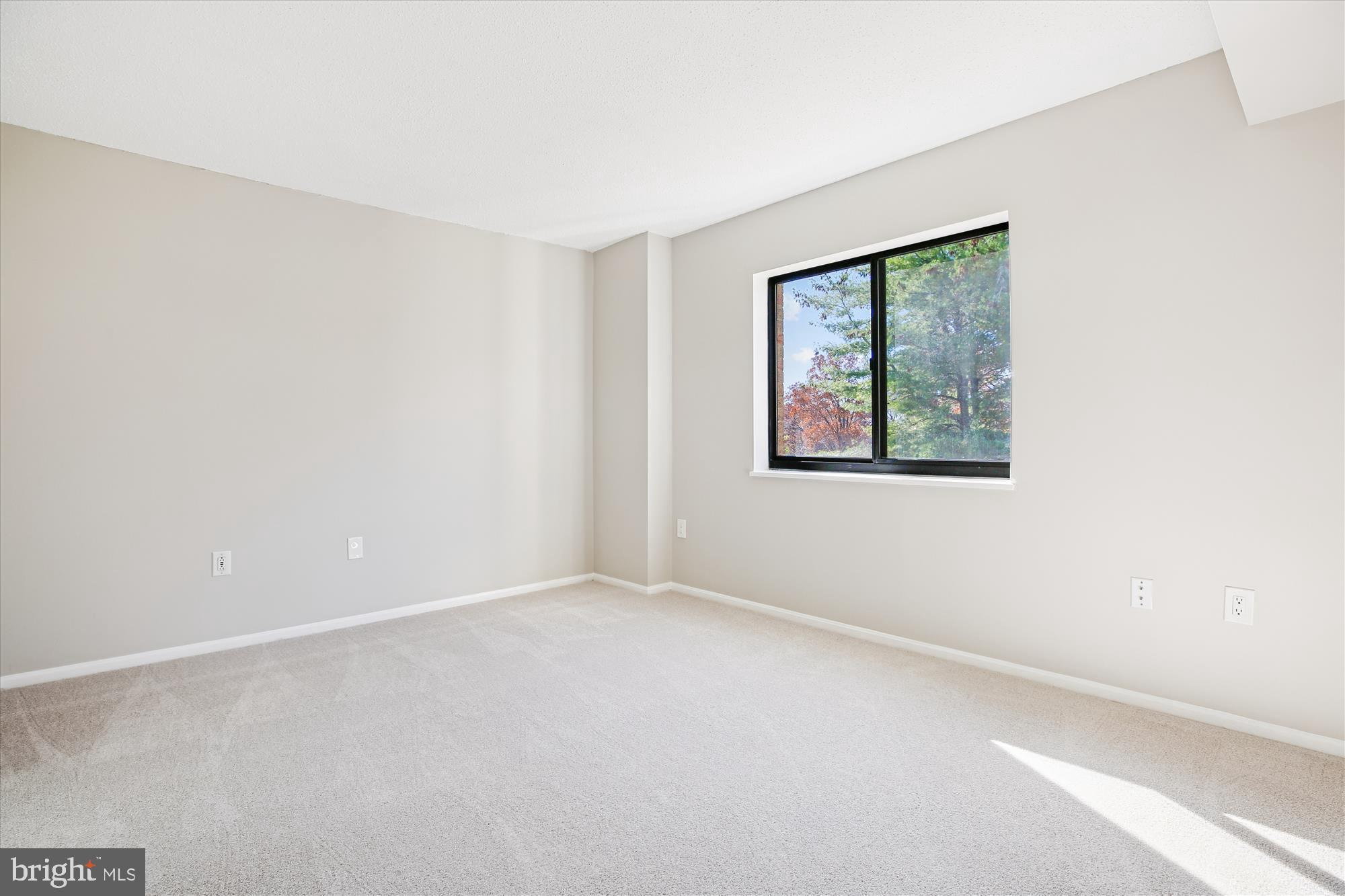 15115 Interlachen Drive, Unit 3308 Silver Spring, MD 20906 - Photo 17 of 50 a view of an empty room with a window