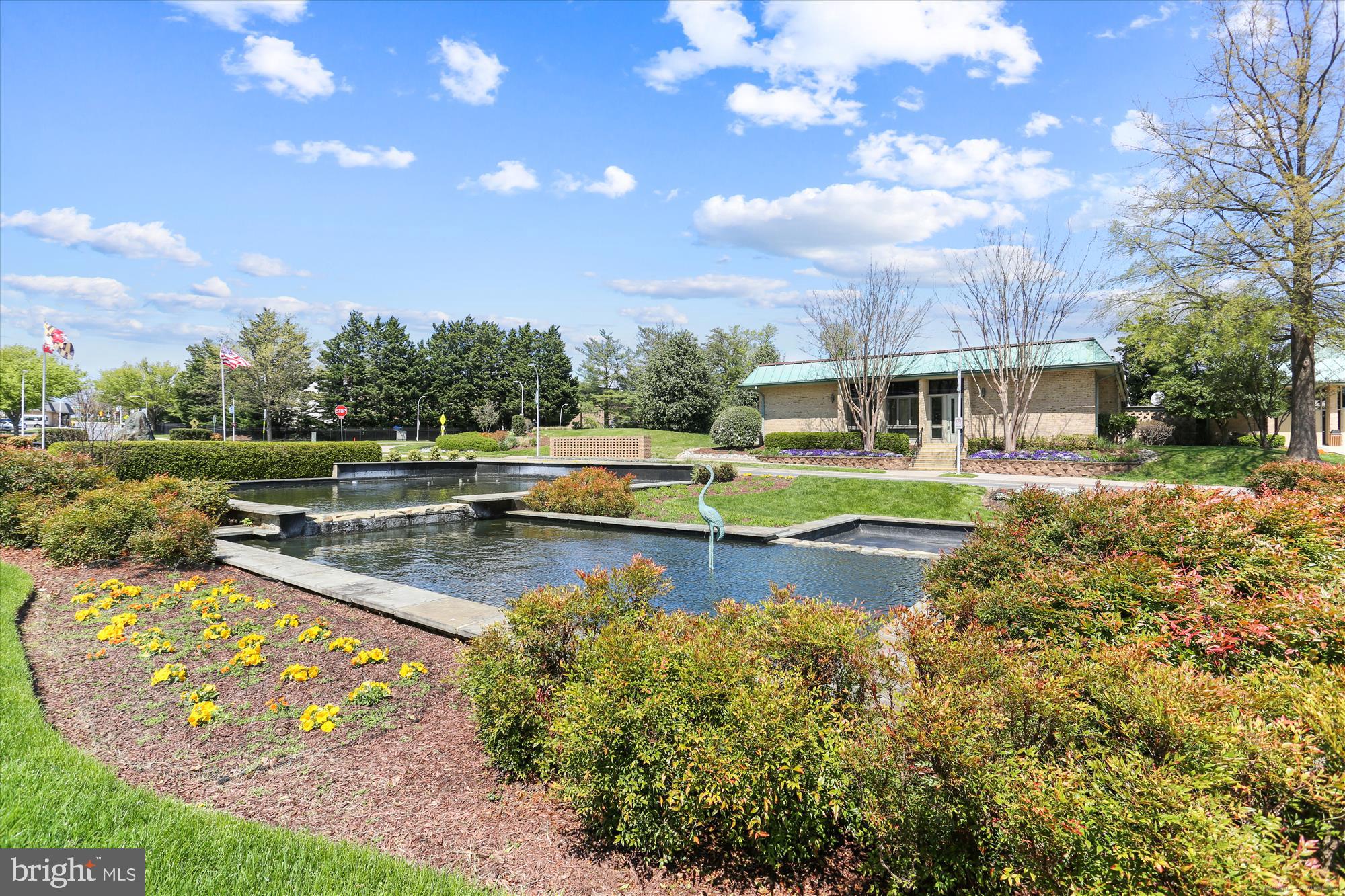 15115 Interlachen Drive, Unit 3308 Silver Spring, MD 20906 - Photo 44 of 50 a view of swimming pool with outdoor seating and trees in the background