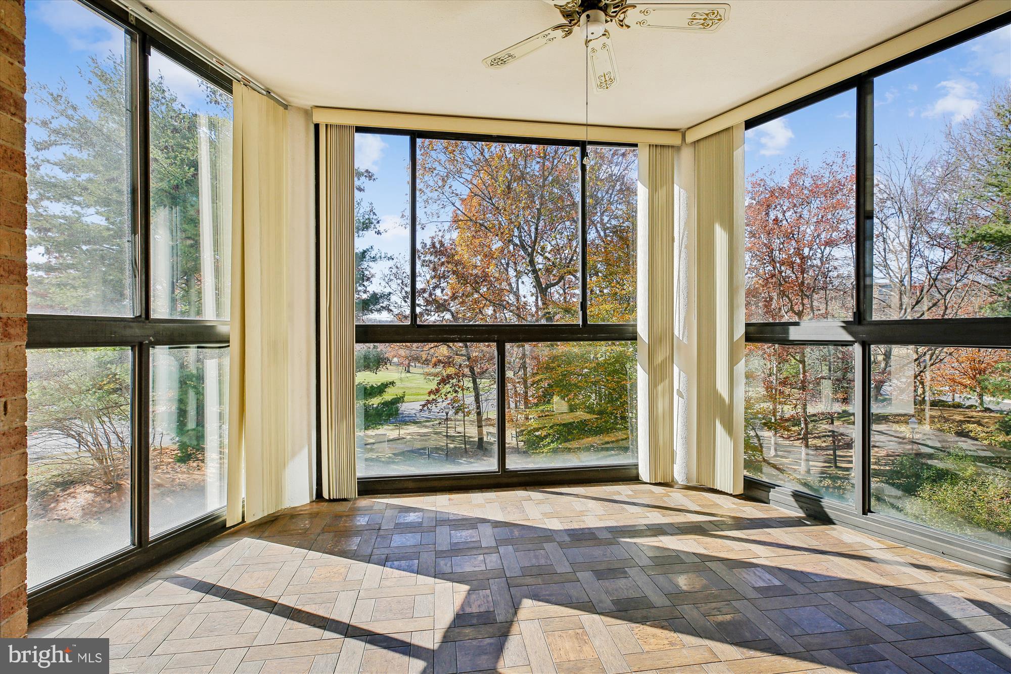 15115 Interlachen Drive, Unit 3308 Silver Spring, MD 20906 - Photo 6 of 50 a view of a room with large windows