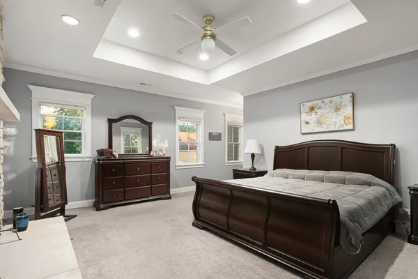 a bedroom with a bed and a dresser