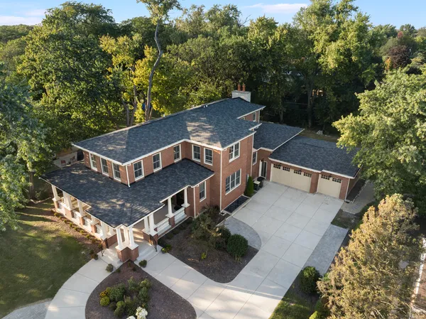 an aerial view of a house with a yard