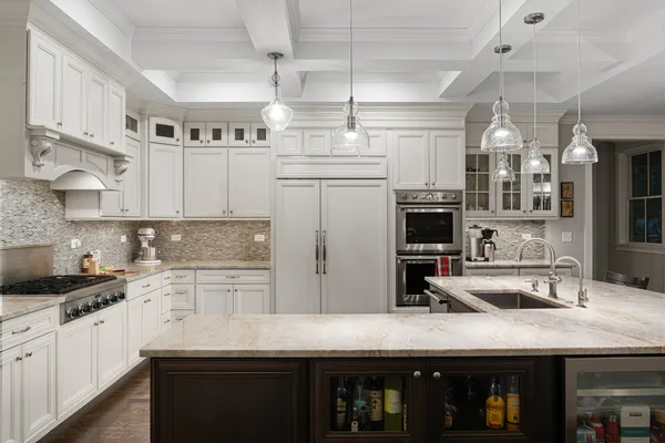 a kitchen with stainless steel appliances granite countertop a sink and cabinets