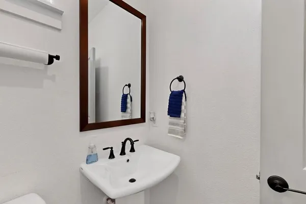 a bathroom with a sink and mirror