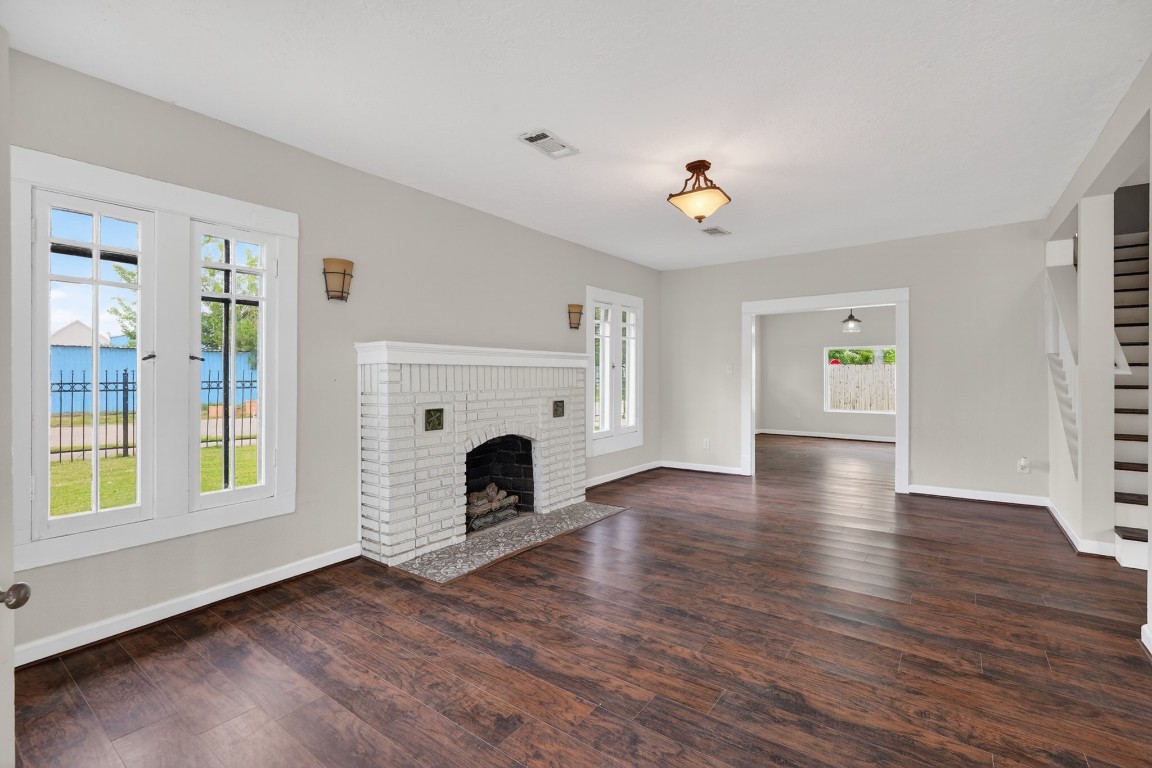 5401 North Capitol Street Houston, TX 77011 - Photo 12 of 39 a view of an empty room with window and wooden floor