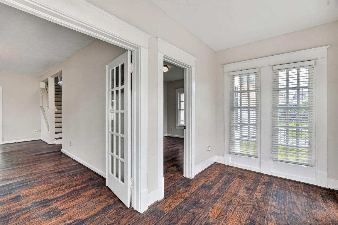 5401 North Capitol Street Houston, TX 77011 - Photo 14 of 39 a view of a hallway with wooden floor and stairs