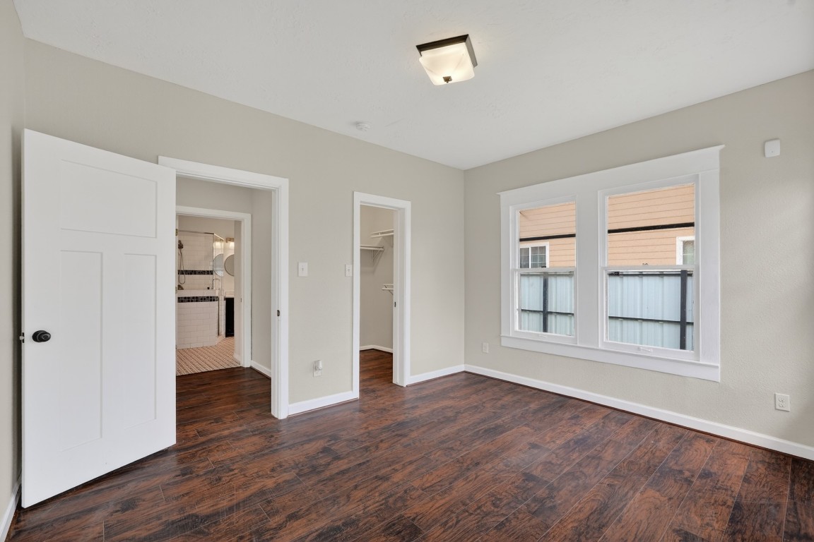 5401 North Capitol Street Houston, TX 77011 - Photo 15 of 39 an empty room with wooden floor and windows